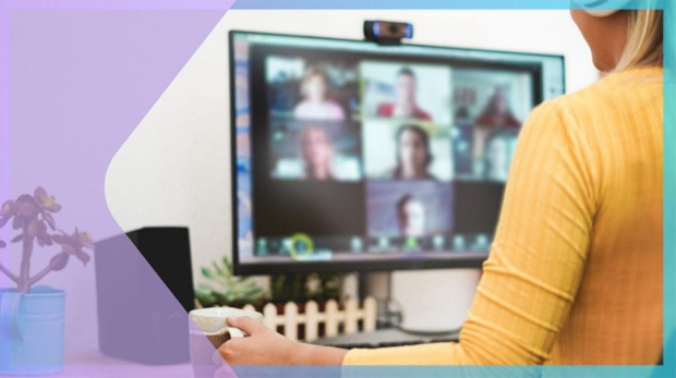 Volunteer participates in a virtual meeting, viewing multiple participants on a computer screen during an online collaboration session.